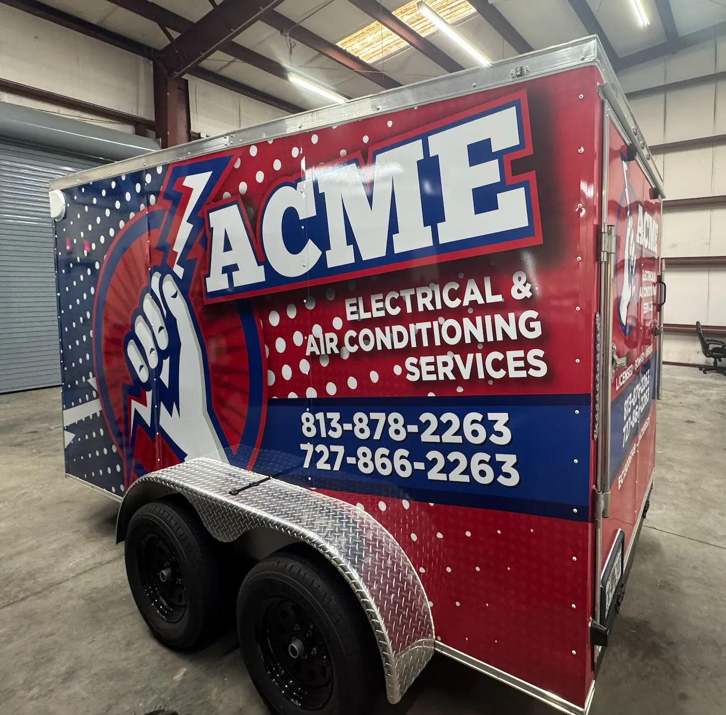 Enclosed utility trailer with red, white, and blue ACME Electrical & Air Conditioning Services vinyl wrap by BAPS Signs & Wraps in Oldsmar, FL