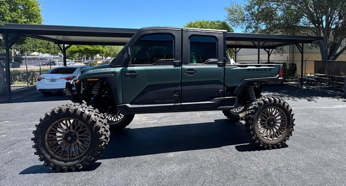 Lifted Polaris Ranger XP 1000 Northstar Edition UTV with two-tone green and black vinyl wrap by BAPS Signs & Wraps in Oldsmar, FL