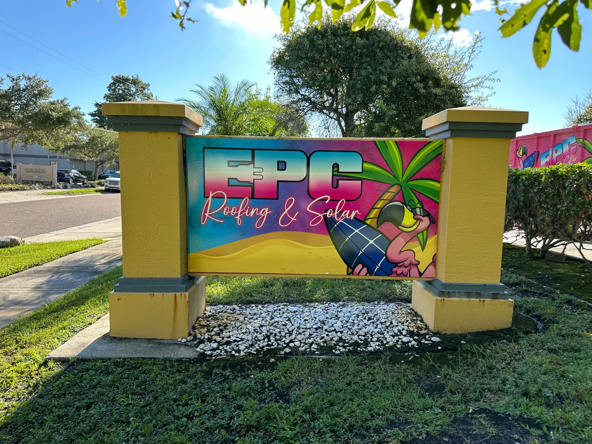 EPC Roofing & Solar tropical-themed monument sign with flamingo graphic built by BAPS Signs & Wraps in Tampa Bay